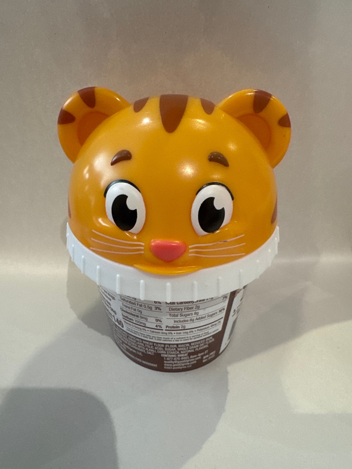 Good 2 Grow Snackers Baked Wheat & Oat Crackers Chocolate or Cinnamon with reusable snack tub and character head lid.