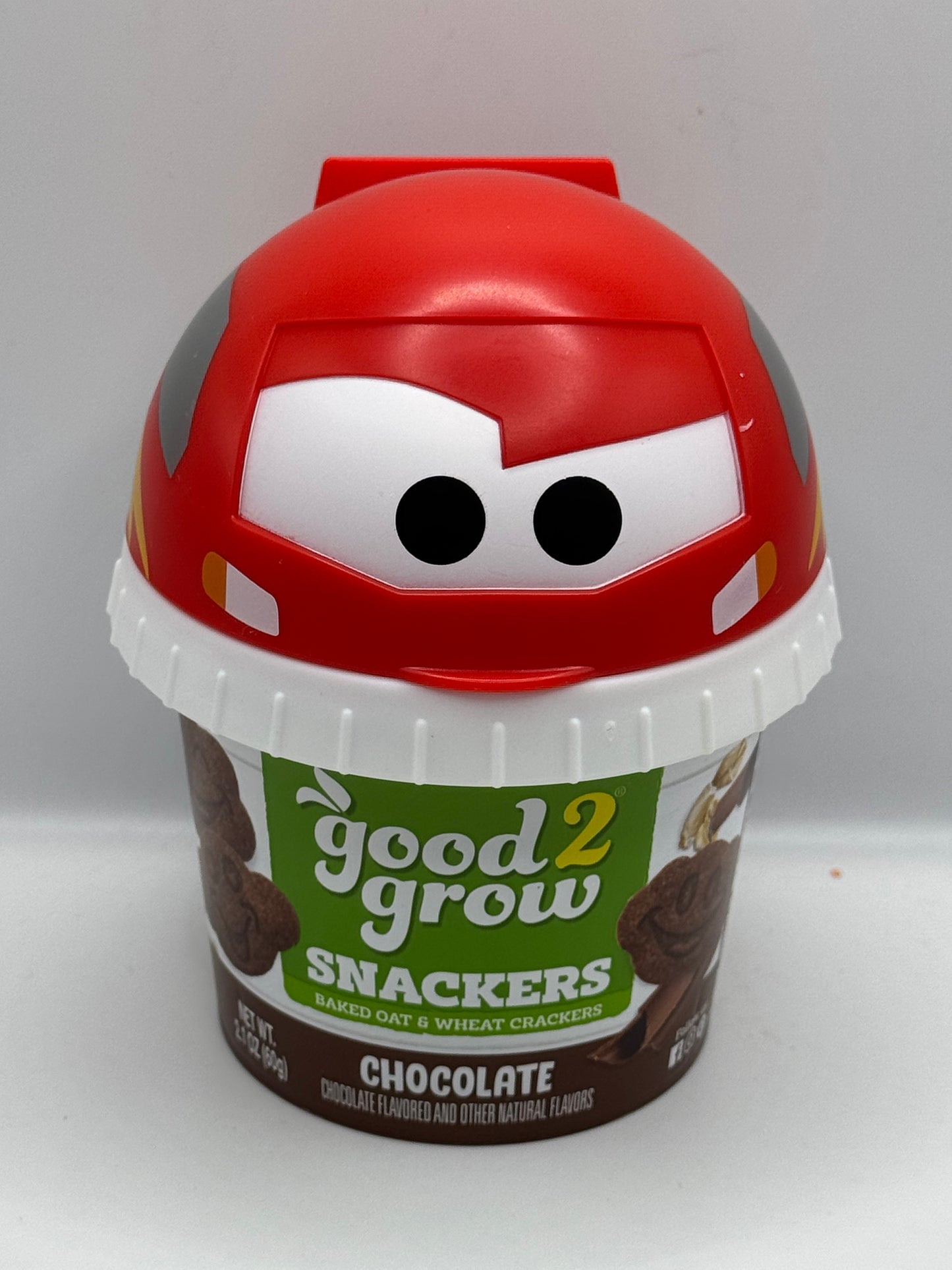 Good 2 Grow Snackers Baked Wheat & Oat Crackers Chocolate or Cinnamon with reusable snack tub and character head lid.