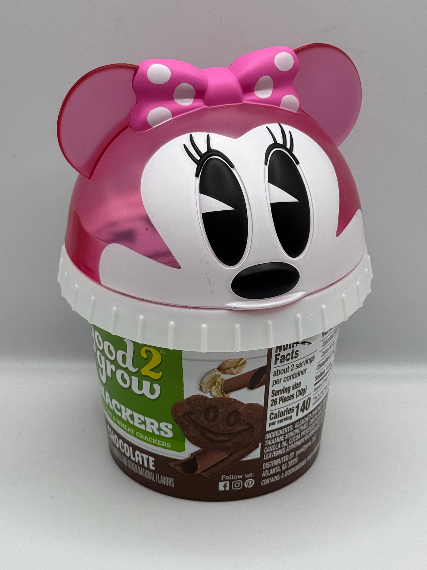 Good 2 Grow Snackers Baked Wheat & Oat Crackers Chocolate or Cinnamon with reusable snack tub and character head lid.