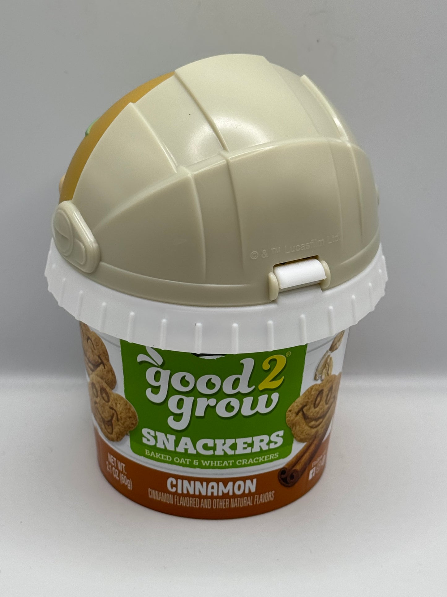 Good 2 Grow Snackers Baked Wheat & Oat Crackers Chocolate or Cinnamon with reusable snack tub and character head lid.